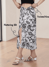 Model wearing floral twist knot midi skirt with slit