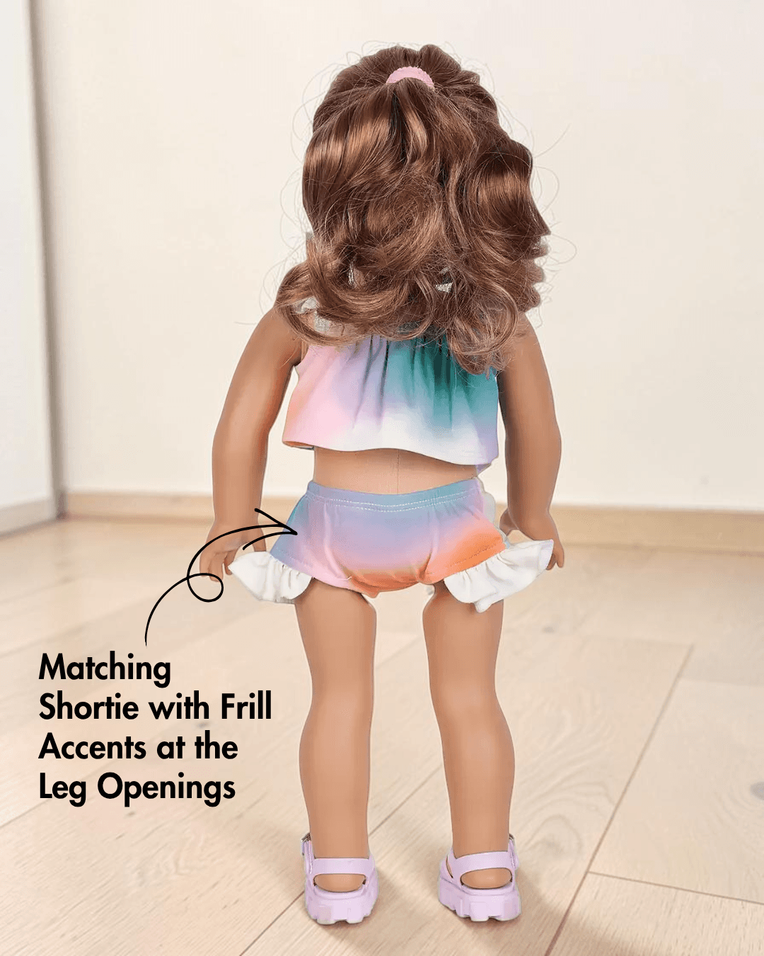 Doll swimwear set sewing pattern with two-piece swimsuit and frill options, back view