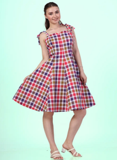 Side angle view of a Model wearing a sleeveless midi dress with adjustable tie-shoulder straps and a square neckline sewed with Winslet's patterns