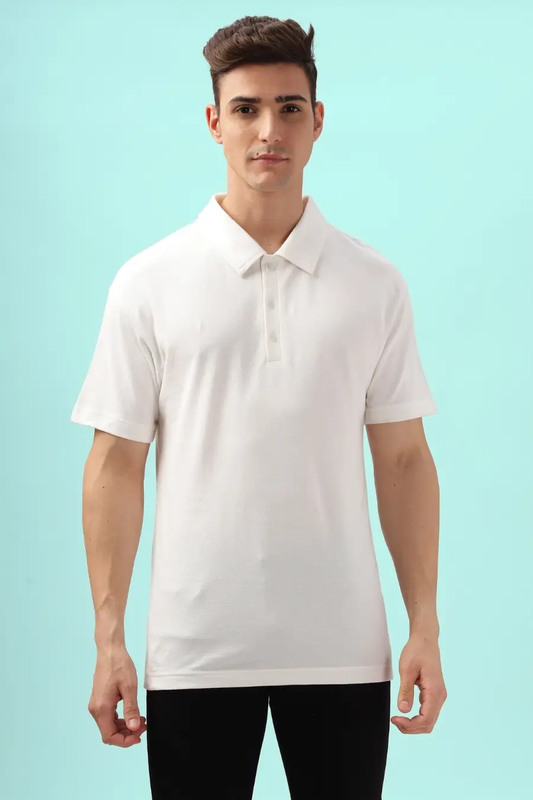 Classic white men's polo shirt made using the 'John' sewing pattern. Features a structured collar and short sleeves, ideal for casual and semi-formal wear.