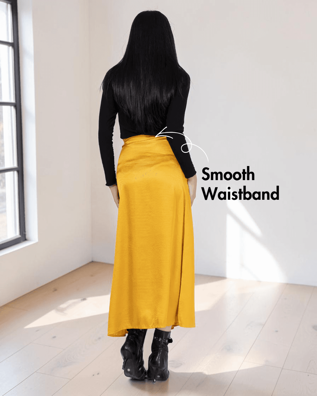 Back view of yellow satin A-line skirt with smooth waistband and invisible zipper
