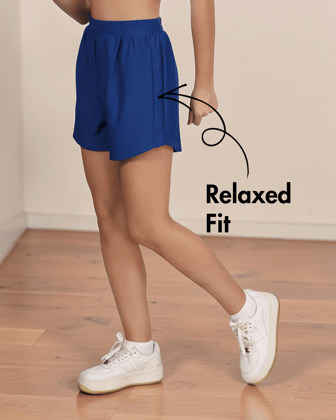 Close-up of women's blue athletic shorts showing pattern details and fit