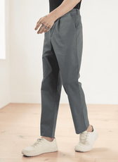 Side view of men's gray formal trousers sewing pattern highlighting back welt pockets, belt loops, and mid-rise waist