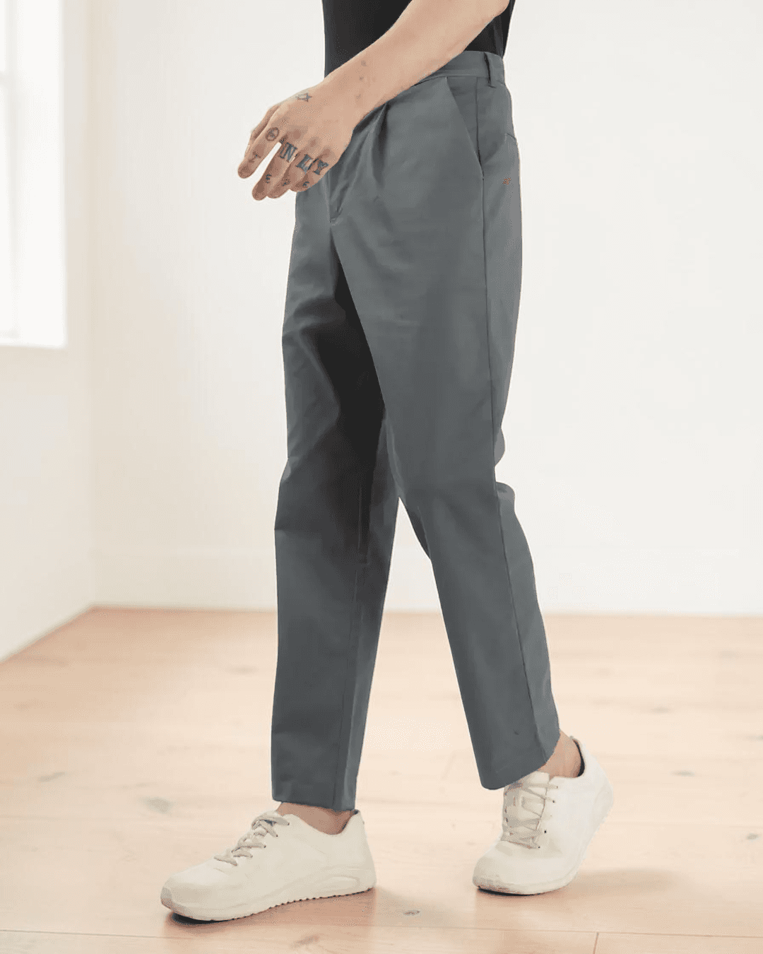 Side view of men's gray formal trousers sewing pattern highlighting back welt pockets, belt loops, and mid-rise waist