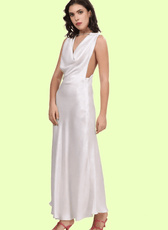 Side angle shot of a model wearing backless cowl neck gown