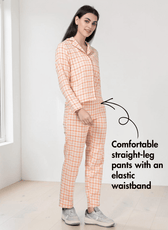 Side view of peach plaid pajama set with collar and straight-leg pants