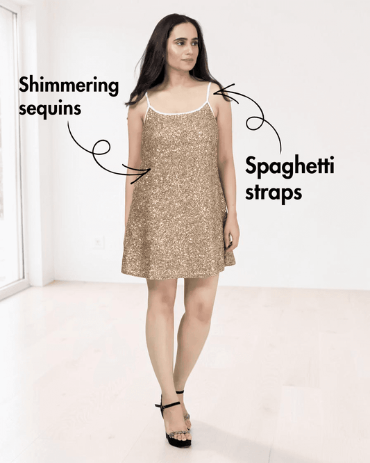 Front view of gold sequin mini dress with spaghetti straps and white trim