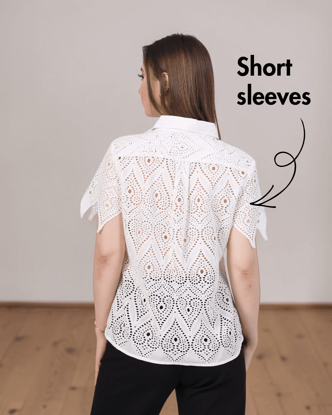 Back view of white eyelet short sleeve women's sewing pattern top with structured collar