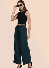 Model wearing high-waisted wide-leg trousers with a belted waist in dark green. Stylish and comfortable design for casual and formal wear.