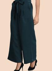 Side view of high-waisted wide-leg trousers with a belted waist. Features pleated detailing and a polished hemline for a refined look.
