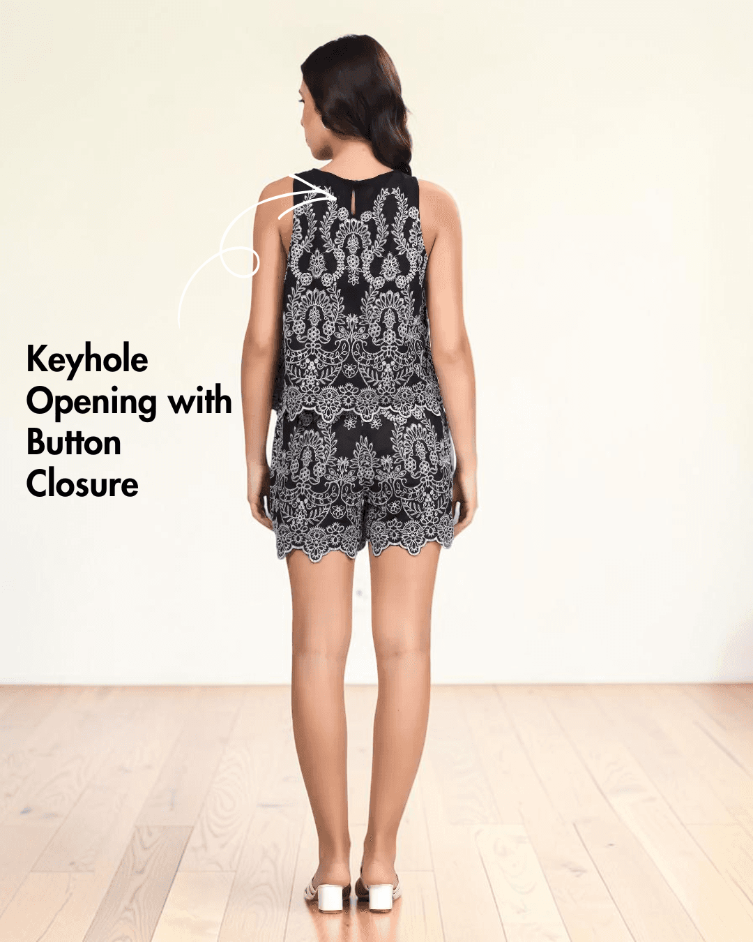 Back view of black and white embroidered summer coord set with scalloped hem and wide straps
