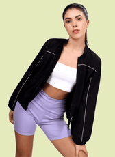 Model posing in the Naomi windbreaker, highlighting its full zip closure and relaxed silhouette. A versatile sewing pattern for stylish outerwear.
