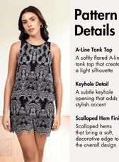 Model wearing black and white embroidered sleeveless top and shorts with keyhole detail