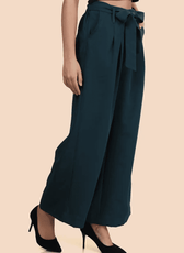 Angled side view of wide-leg trousers with a belted waist. The relaxed fit and structured design offer both comfort and elegance.