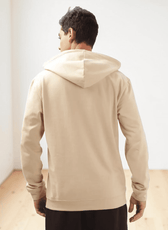 Back view of beige hoodie sewing pattern with adjustable drawstring hood
