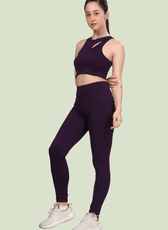 Side view of Layla cutout sports bra in deep purple. The fitted design and sleeveless cut make it ideal for workouts and everyday wear.