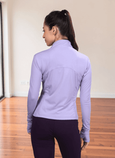 Women wearing lavender sports jacket with high collar and full zip