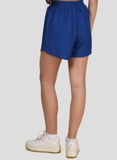 Back view of blue training shorts created with the 'Maria' sewing pattern. Features an elastic waistband and a relaxed fit for movement.