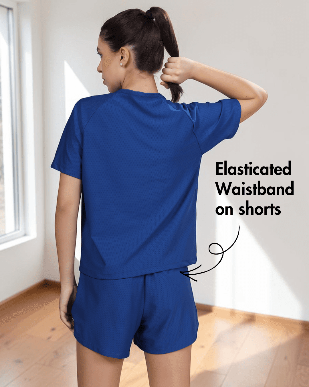 Back view of blue activewear set with elasticated waistband shorts