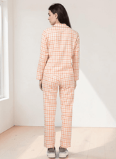 Back view of peach plaid pajama set with collar and straight-leg pants