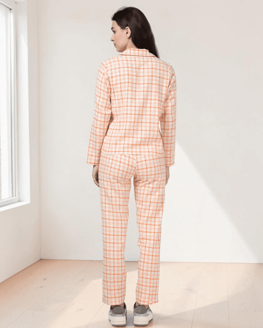 Back view of peach plaid pajama set with collar and straight-leg pants