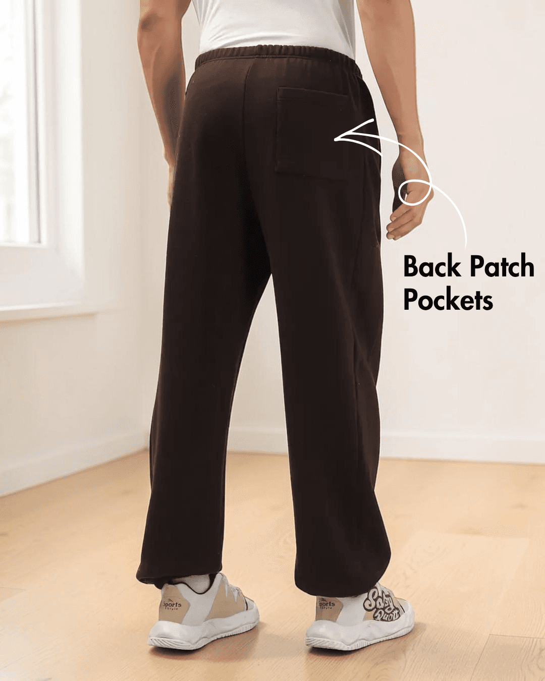 Back view of men's joggers sewing pattern with patch pockets and relaxed straight-leg silhouette