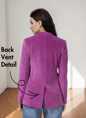 Back view of women's pink blazer highlighting back vent detail and tailored fit