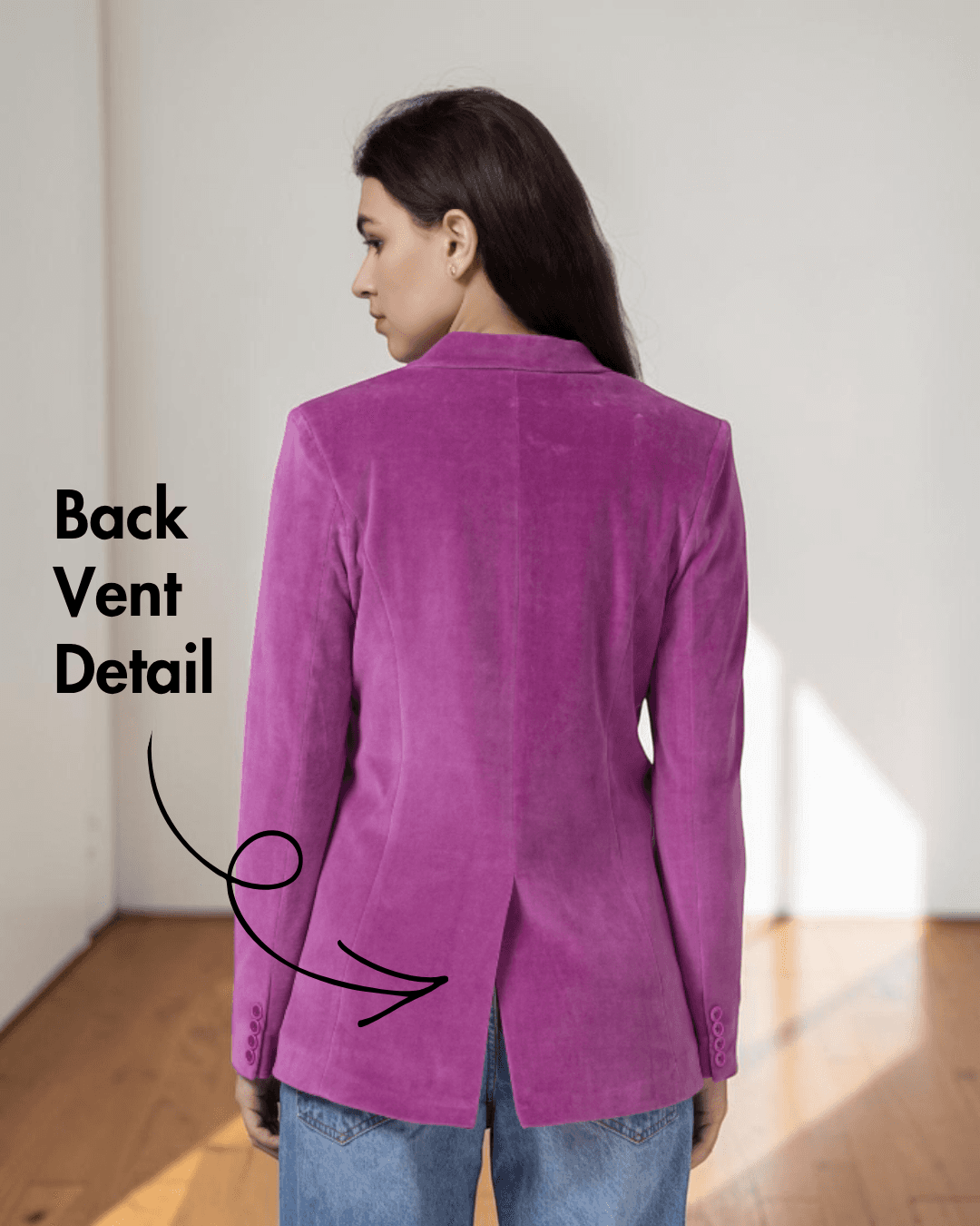 Back view of women's pink blazer highlighting back vent detail and tailored fit