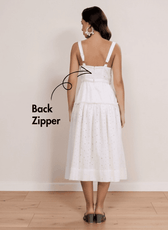 Back view of white midi sundress with back zipper, adjustable straps, and tiered skirt, based on Fiona sewing pattern