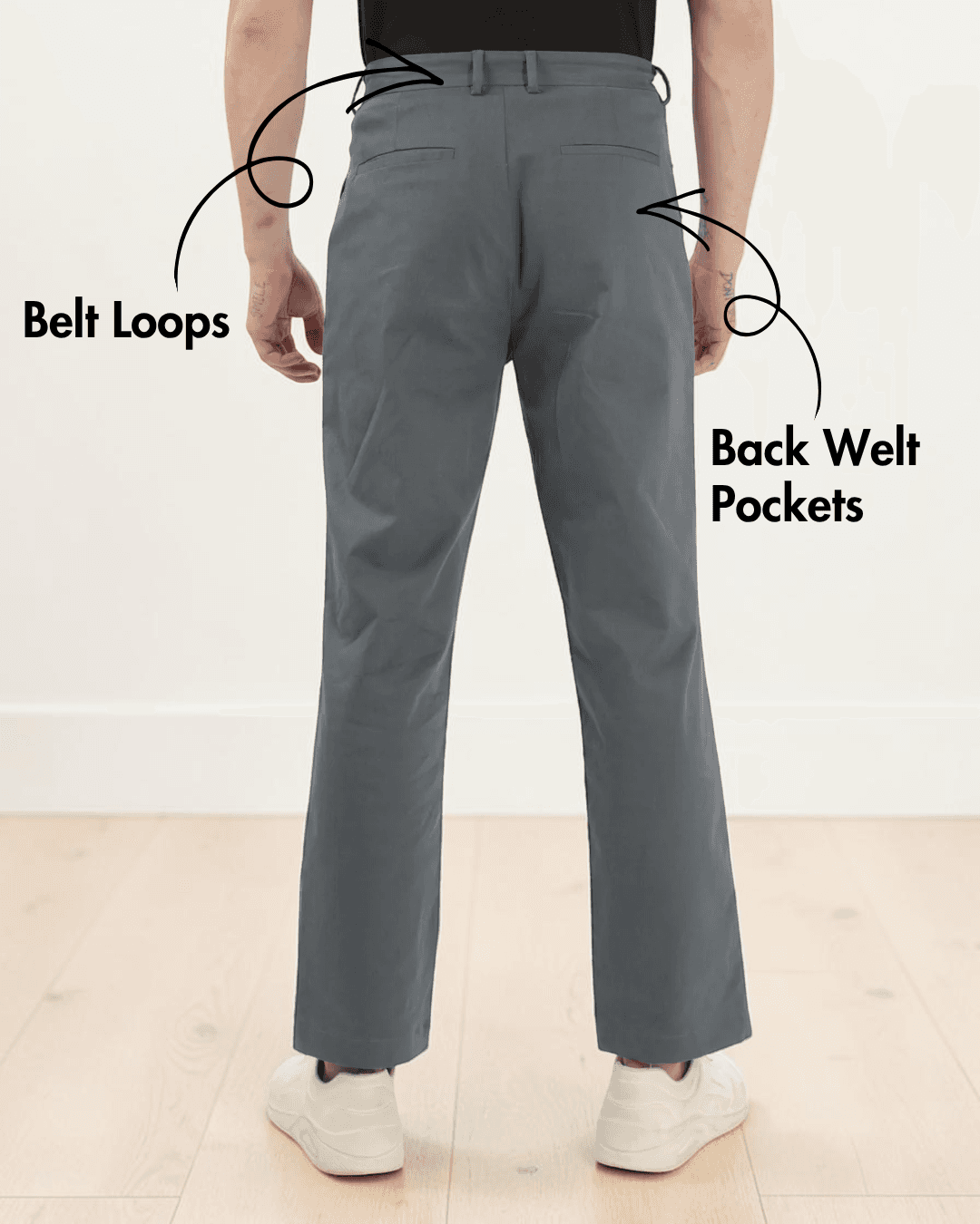 Back view of men's gray formal trousers sewing pattern highlighting back welt pockets, belt loops, and mid-rise waist