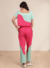 Back view of women's color block coord set showing wide square neckline and curved color-block panels