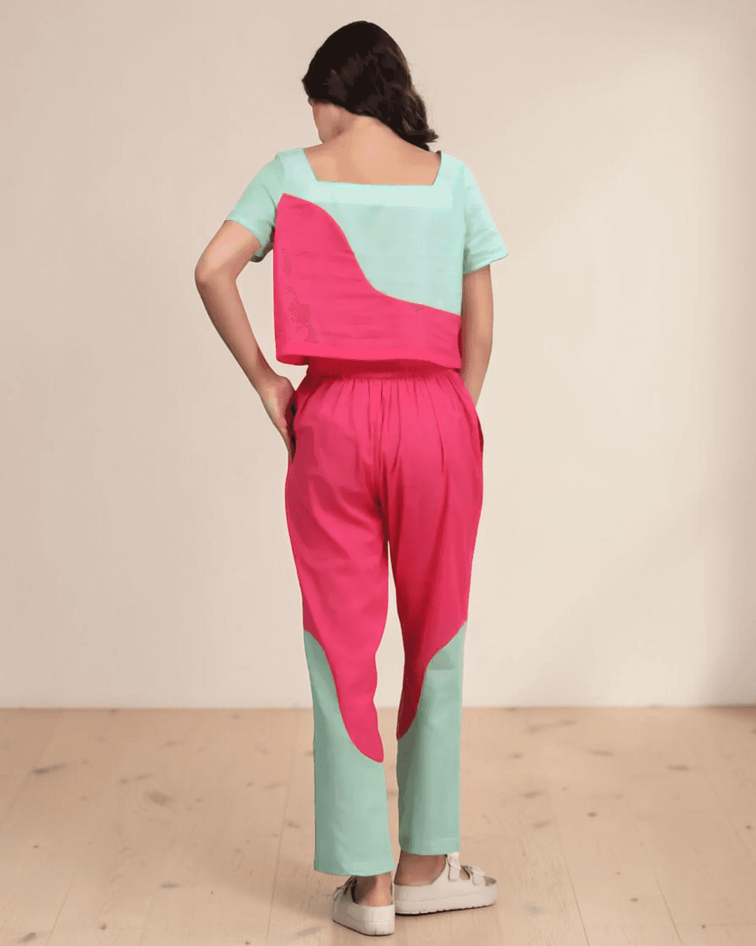 Back view of women's color block coord set showing wide square neckline and curved color-block panels