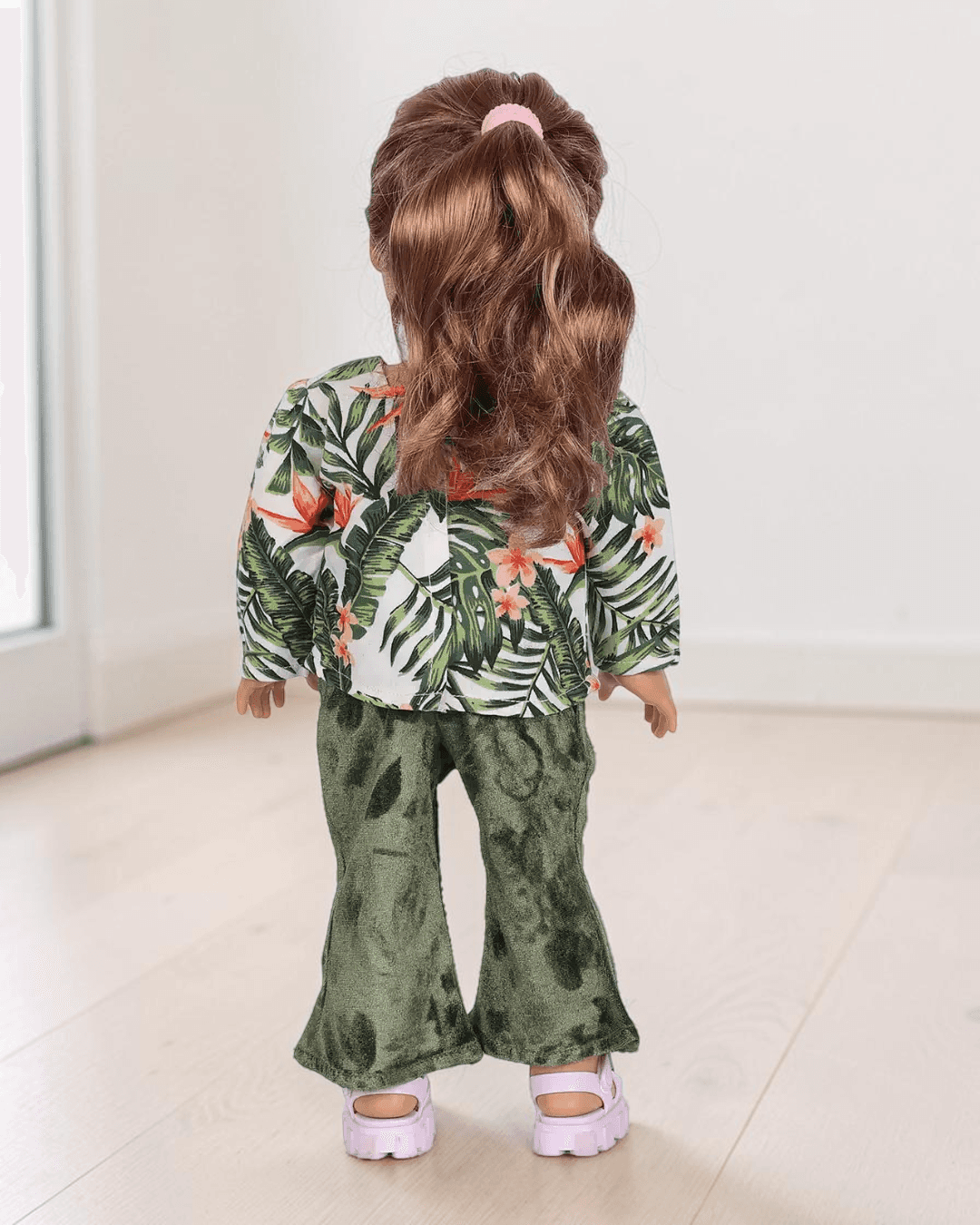 Doll with floral top and velvet flared pants sewing pattern back view
