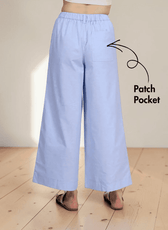 Back view of light blue wide leg pants with patch pocket, elastic waistband, and relaxed fit
