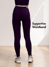 Model demonstrating high-waisted leggings with side pockets and full length