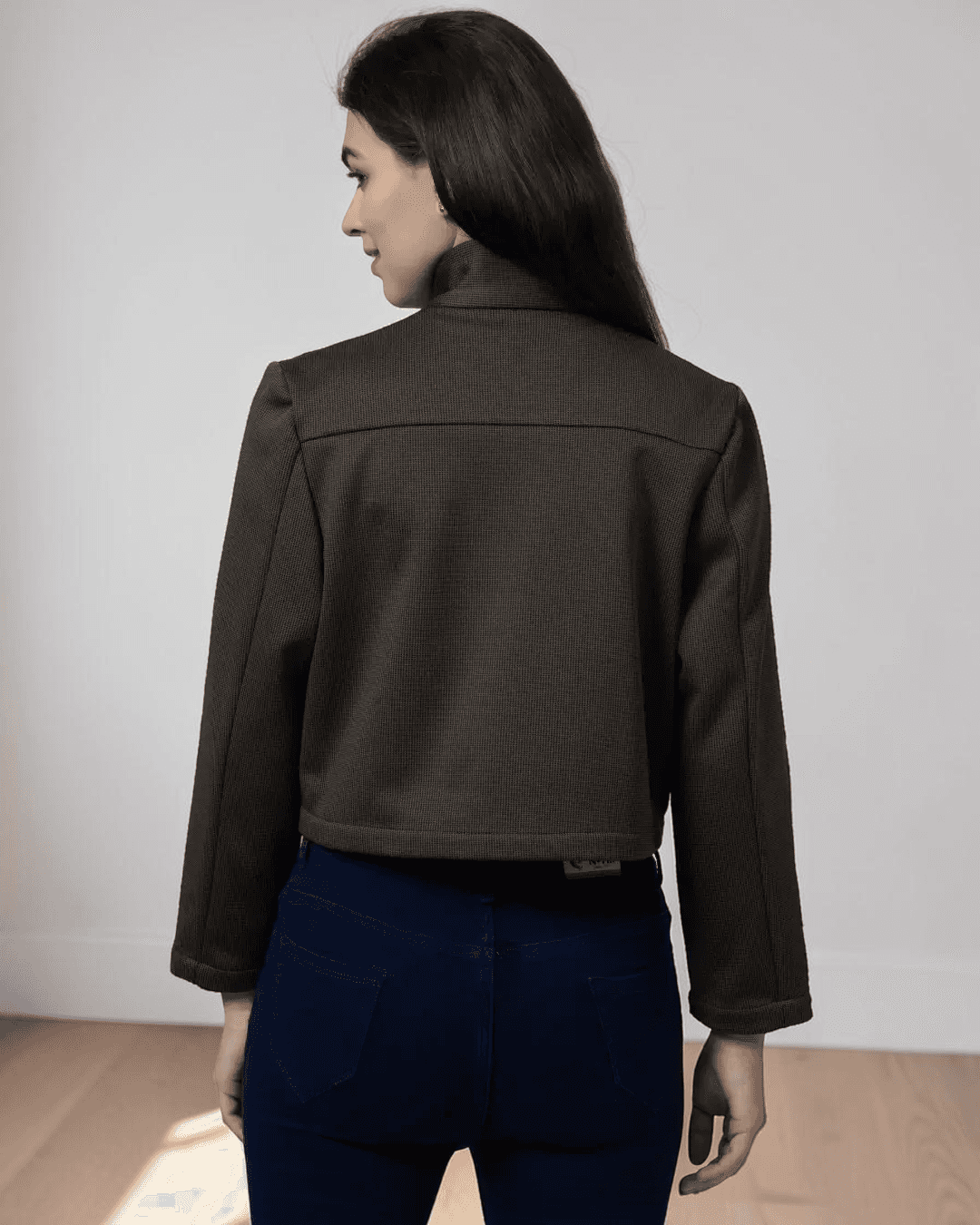 Close-up of pattern details showing cropped design, button front, and flap chest pockets