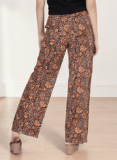Close-up of patterned wide leg pants with high waist and structured waistband