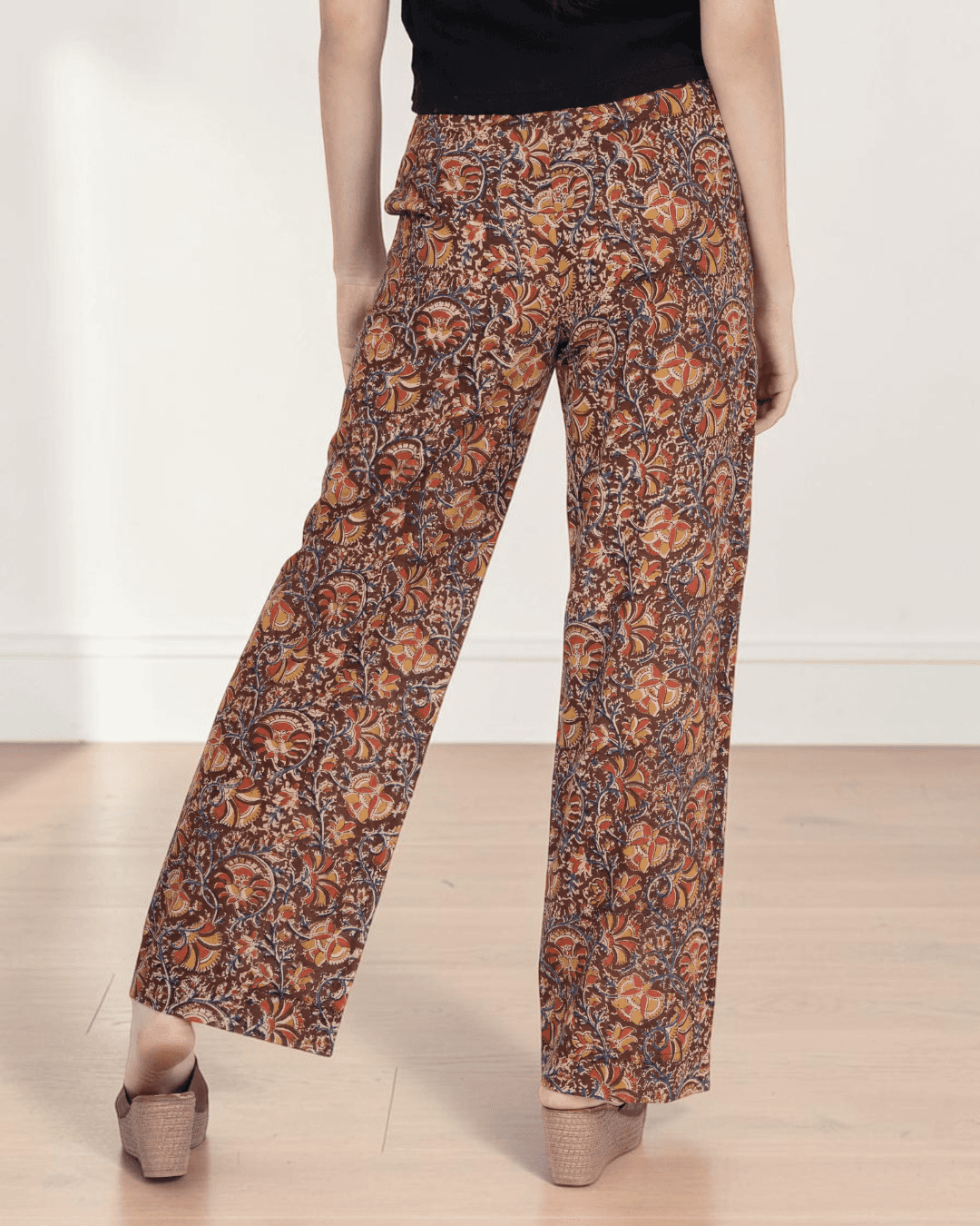 Close-up of patterned wide leg pants with high waist and structured waistband