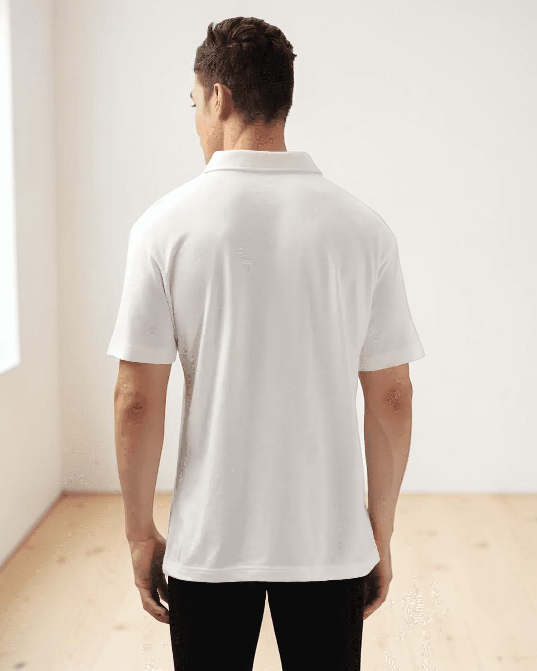 Back view of men's white polo shirt with straight hem, casual fit, sewing pattern details