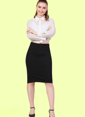 Full length image of a model wearing Cropped, long-sleeve shirt with a classic collar paired with a black midi skirt.