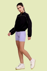 Model walking in the Naomi windbreaker, paired with casual activewear. A modern and stylish sewing pattern for a lightweight jacket.