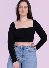 Image of model wearing a black square neck top sewed with winslet's patterns