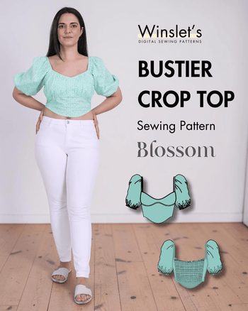 Model wearing green puff sleeve bustier crop top with shirred bodice and scoop neckline
