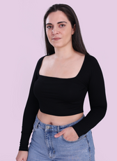 Image of model wearing a black square neck top sewed with winslet's patterns paired with blue jeans