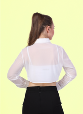 Back view of a model wearing Cropped, long-sleeve shirt with a classic collar paired with a black midi skirt