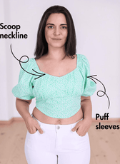 Close-up of green puff sleeve crop top with shirred back and short puff sleeves