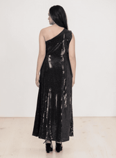 Back view of black sequined one shoulder dress with thigh-high slit
