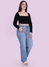 Full length Image of model wearing a black square neck top sewed with winslet's patterns