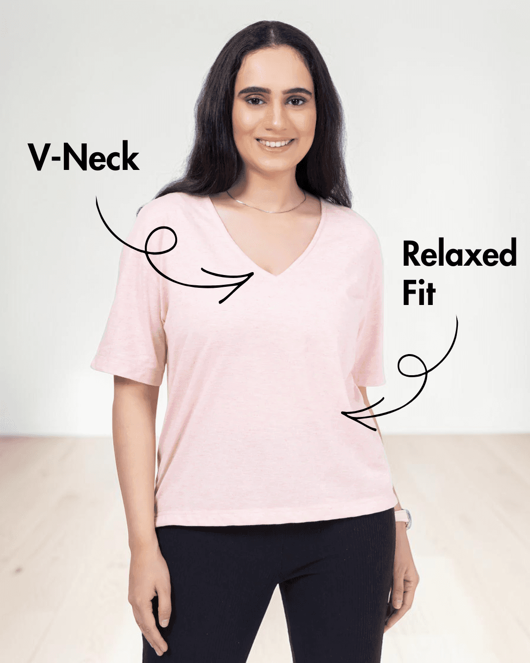 Close-up of woman in pink V-neck T-shirt, showing relaxed fit and short sleeves