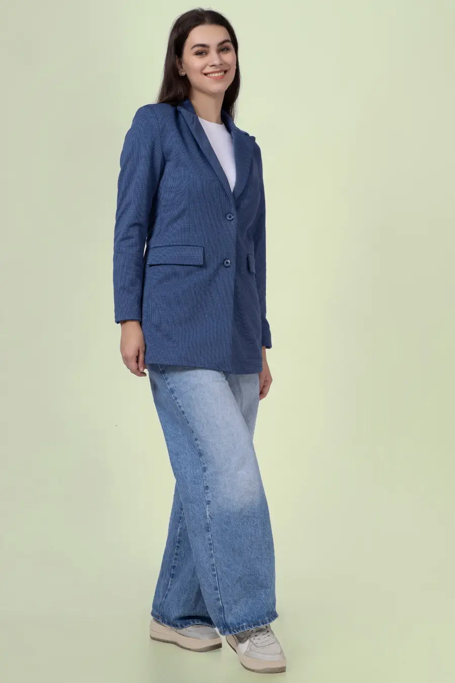 Casual styling of the 'Camille' straight-cut coat sewing pattern. The blue coat is paired with wide-leg jeans and sneakers for a relaxed yet polished look.